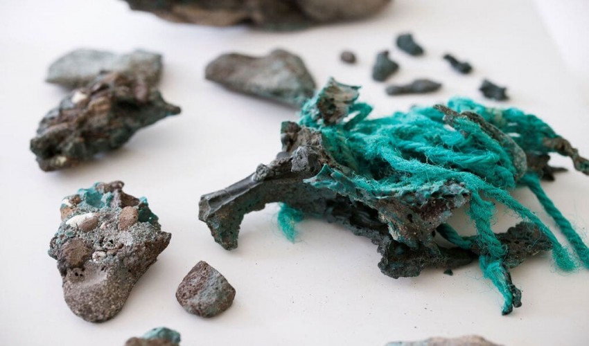 Chinese scientists discover plastic trash chemically attached to rocks.